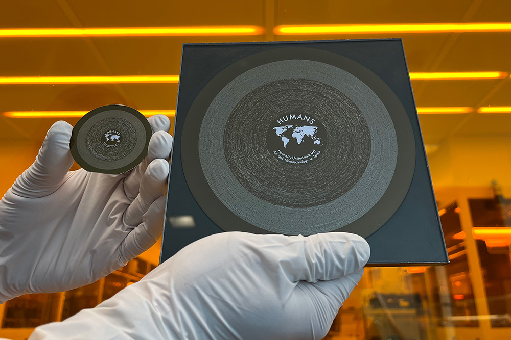 The 2-inch Humanity United with MIT Art and Nanotechnology in Space (HUMANS) wafer (left) landed on the moon March 6 aboard the Athena spacecraft. It is seen alongside its 6-inch counterpart, which flew to the International Space Station in 2023.
