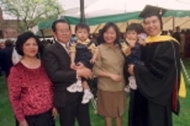 Tiauw H. Go (far right), a newly minted PhD in aeronautics and astronautics, holds his 17-month-old son, Jusvin. Other members of his family who shared the day were (from left) his mother Ratmawati Go, his father Sik Go (holding Jusvin's twin brother, Jason) and his wife Mey Go.