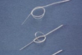 Photo above (Copyright Science magazine) shows how a fiber of the new biodegradable plastic with "memory" can  be used to tie a smart suture. After forming a loose knot, the ends of the suture  were fixed. The series shows from top to bottom how the knot tightened in 20 seconds  when heated to 40 degrees C.
