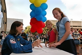 At the "Reach for the Stars" event at MIT, astronaut Sally Ride signs autographs for Arianna Schatzki-McClain (center) and Sarah Straubinger of Chenery Middle School in Belmont.