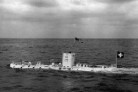 The U.S. Navy bathyscaphe Trieste under tow, en route to a deep water dive in the Pacific on Sept. 15, 1959. Commander Walsh said the vessel flew both the American and Swiss flags to symbolize the joint venture.