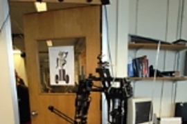 CSAIL's latest robot, Cardea, opens the door to go for a "stroll" in the lab.