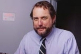 Stephen Benton in his MIT Laboratory in 1998, with an early holovideo apparatus.