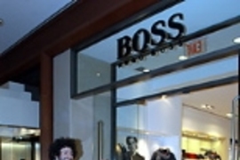 Bass enters the Hugo Boss shop to begin his makeover.