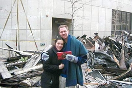 MIT teaching assistant Wes Austin and his girlfriend, Tanya Stankunas, hold a chocolate bar that miraculously survived the fire in their apartment.
