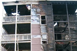 Wes Austin's apartment building following the fire that destroyed many of his belongings.