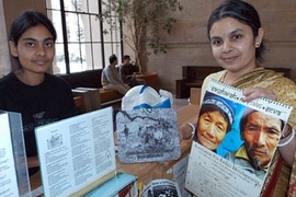 Aparna Jonnalagadda (left), a senior in mechanical engineering, and her mother, Vidya Jonnalagadda, a postdoctoral associate in biological engineering, sell calendars made by students in India. Together they collected donations for tsunami relief in Lobby 10.