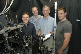MIT Professor Wolfgang Ketterle, second from right, poses with three fellow researchers involved in the creation of a new form of matter, a superfluid gas of fermions. From left are Martin Zwierlein, Christian Schunck, Wolfgang Ketterle and Andre Schirotzek.
