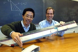 Professors Yet-Ming Chiang, left, and Steven Hall show components of their electrochemically actuated morphing rotor prototype (foreground) as well as a reduced-scale model (background) of a previous technology that uses piezoelectrics as the active materials.