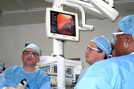 Dr. Raphael Bueno, left, and team use a new MIT technology to shrink a patient's lung tumor by more than 90 percent during laser surgery at Brigham and Women's Hospital.