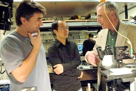 Postdoctoral associate Gabriel Popescu, left, mechanical engineering graduate student YongKeun Park, center, and Professor Michael Feld, right, use spectroscopy to study changes in the membranes of living cells.