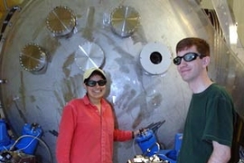 Assistant professor Nergis Mavalvala, left, and Ph.D. student Thomas Corbitt are part of an international team that has devised a way to cool large objects to near absolute zero.
