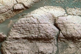 Taken by the panoramic camera on the Mars Exploration Rover Opportunity, image shows a close up of the rock dubbed 'El Capitan.'  The iron-bearing mineral jarosite, which was found in the rock, led MIT and Harvard researchers to posit that early Mars may have had the greenhouse gas sulfur dioxide in its atmosphere.