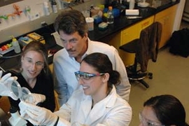 MIT researchers survey the evidence of their success in figuring out how to make surface coatings that bacteria won't stick to. From left, assistant professor of material science and engineering Krystyn Van Vliet, director of the MIT Center for Materials Science and Engineering Michael Rubner; and materials science and engineering graduate student  Jenny Lichter and senior Maricela Delgadillo.