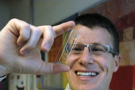 Roman Stocker holds the small microbial ecosystem he developed.