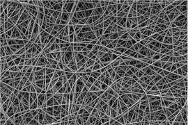 A scanning electron micrograph of an electrospun nonwoven mat of poly(styrene-co-dimethylsiloxane) fibers, showing the porous, nonwoven structure of the mat.