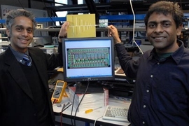 Associate Professor of Electrical Engineering Rahul Sarpeshkar, left, and Soumyajit Mandal display their RF (radio frequency) cochlea, a low-power, ultra-broadband radio chip. The chip, held by Mandal, is attached to an antenna, held by Sarpeshkar. The diagram on the computer monitor shows the wiring layout of the chip.