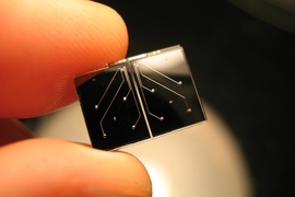 MIT researchers designed this tiny microfluidic chip that can measure the mass and density of single cells.
