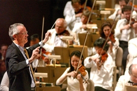 Former MIT President Charles M. Vest serves as a guest conductor for the Boston Pops.