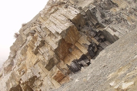 A photo of the permian triassic boundary at Meishan, China. This photo shows the limestone beds in between the volcanic ash beds that the researchers were able to date.