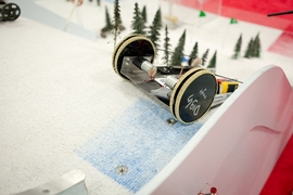 A robot nears the crest of the ski slope in the final competition on Thursday night.