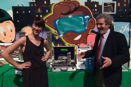 Neil Gershenfeld, director of MIT's Center for Bits and Atoms (right), and graduate student Nadya Peek talk about MIT's Mobile Fab Lab during the first-ever White House "Maker Faire."
