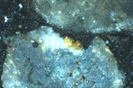 Microscope image of a single chondrule from the Semarkona meteorite used in this study. Textured, light-blue regions represent concentrations of dusty olivine, which carry a recording of ancient magnetic fields from the protoplanetary disk. 