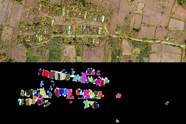 Using the same original satellite image, the team's new software determined where buildings were, creating a mask that is black where there are no buildings, and white where there are. Then, it further divided the "buildings" area into polygons corresponding to each separate building, using arbitrary colors to allow each building to be clearly differentiated from the next.