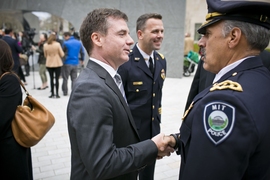 Israel Ruiz, MIT's Executive Vice President and Treasurer (center), shook hands with John DiFava, MIT's director of campus services and chief of police, following the dedication ceremony.