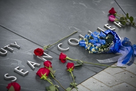Situated on the site where Officer Sean Collier was killed on April 18, 2013, the Collier Memorial is composed of 32 blocks of granite that form a five-way stone vault. The smooth, curved vault contains the inscription: “In the line of duty, Sean Collier, April 18, 2013.”