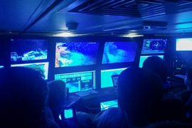 Researchers watch underwater footage taken by various AUVs exploring Australia's Scott Reef.