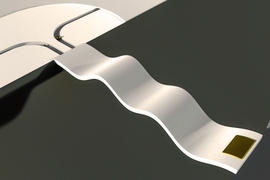A suspended microchannel resonator (SMR) measures particles’ masses as they flow through a narrow channel. The original mass sensor consists of a fluid-filled microchannel etched in a tiny silicon cantilever that vibrates inside a vacuum cavity. As cells or particles flow through the channel, one at a time, their mass slightly alters the cantilever’s vibration frequency. This illustration depi...