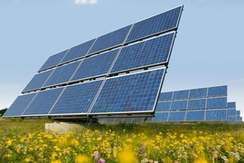 Solar panels on a grassy ridge