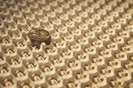 The gyroid surface with a dime on top.