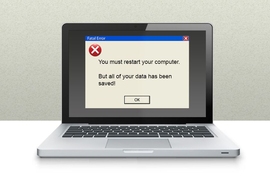 Graphic of a laptop computer with a system warning on it