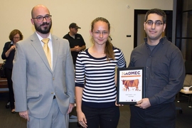 (left to right) Michael Tarkanian, who runs MADMEC, stands with Alexandra Sourakov and Ahmed Al-Obeidi of Glasswings, the winning team of the MADMEC competition. The MIT team created a low-cost coating for solar cells that mitigates reflection, allowing the cells to absorb nearly all light to boost efficiency.