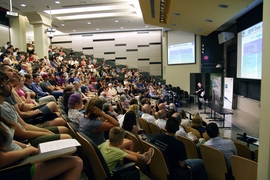 Before a packed audience in MIT’s Huntington Hall, professor of planetary sciences Richard Binzel described the intense timeline of activity surrounding the New Horizons mission's close approach to Pluto in July, after more than nine years of travel time to the outskirts of the solar system.