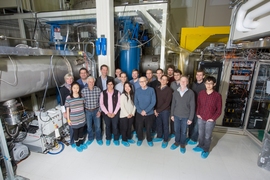 Many of the members of the LIGO Group at MIT, including students, postdocs, engineers, staff, and faculty, gather in front of the full-scale LASTI testbed.