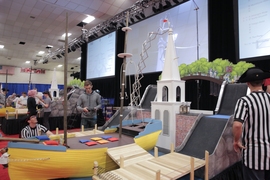 In head-to-head battles, robots sought to outscore their opponent by completing various tasks on the course, including hanging small lanterns on the North Church steeple, pushing bags of tea off a wooden ship, scaling a steep hill to simulate Paul Revere’s ride, and hiding cannonballs under the Old North Bridge. 