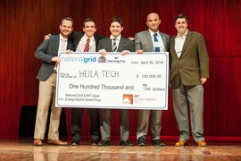 The MIT team Heila Technologies, including John Donnal (second from right) and Jorge Elizondo (center), won the $100,000 grand prize at the MIT Clean Energy Prize, held Saturday.