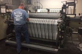 Marty Ellis, of Inman Mills in South Carolina, checks a machine manufacturing fabric developed through AFFOA.
