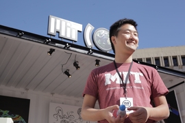 “We got a lot of traffic here, all Boston locals,” said PhD candidate You Wu about the MIT — For a Better World exhibit at The HUB, part of the 2017 HUBweek celebration. Wu is holding a Robot Daisy, a soft, rubbery robot designed to move through municipal water pipes and detect leaks.