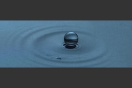 A drop of silicone oil “levitating” on a bath of liquid.