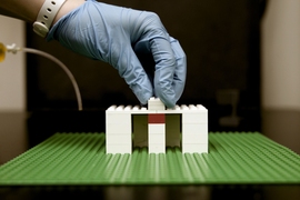 A researcher builds a platform for a system of fluidic bricks.