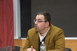 Daron Acemoglu (left), the Elizabeth and James Killian Professor of Economics at MIT, at the Starr Forum.