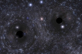 A snapshot of a simulation showing a binary black hole formed in the center of a dense star cluster.