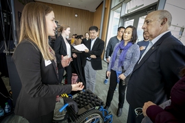 Loop team members Sarah Tress (left) and Shannon McCoy (second from left), both juniors in mechanical engineering at MIT, explain to attendees their wheelchair cushion made of readily available and inexpensive bicycle inner tubes that aims to prevent pressure sores. The team took home a $7,500 prize from the competition for their invention.
