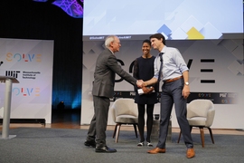 MIT President L. Rafael Reif, left, greeted Prime Minister Trudeau before his talk at the MIT Solve conference. Trudeau was then interviewed by Media Lab assistant professor Danielle Wood, center.