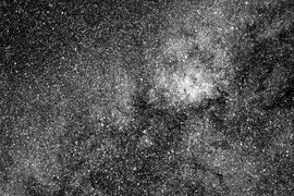 This test image from one of the four cameras aboard the Transiting Exoplanet Survey Satellite (TESS) captures a swath of the southern sky along the plane of our galaxy. More than 200,000 stars are visible. The image, which is centered in the constellation Centaurus, includes dark tendrils from the Coal Sack Nebula and the bright emission nebula Ced 122 (upper right).The bright star at bottom cente...