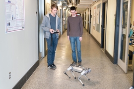 Lead developer Benjamin Katz, left, and co-author Jared Di Carlo, were inspired by a class they took last year, taught by EECS Professor Russ Tedrake, and set about programming the mini cheetah to perform a backflip.
